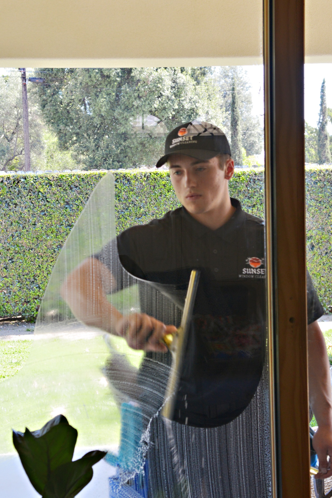 Sunset Window Cleaning technician at work in Southern California
